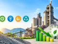Modern cement plant with energy-efficient equipment, declining energy consumption chart, and sustainability icons.